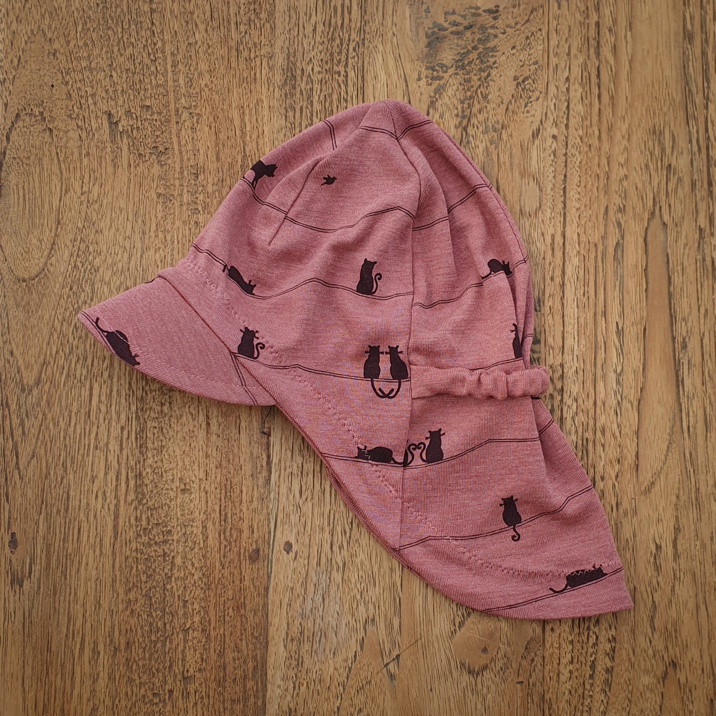 Sonnenhut Muster auf rosa, lila, pink